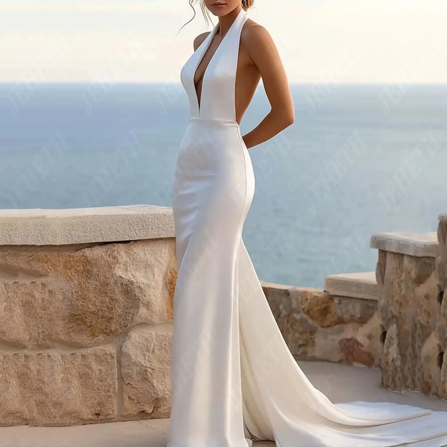 woman in a white mermaid wedding dress with halter top and court train.Boho Wedding Dress Mermaid Satin Deep V Neckline, This satin halter mermaid wedding gown exudes refined elegance with its deep V neckline and backless design