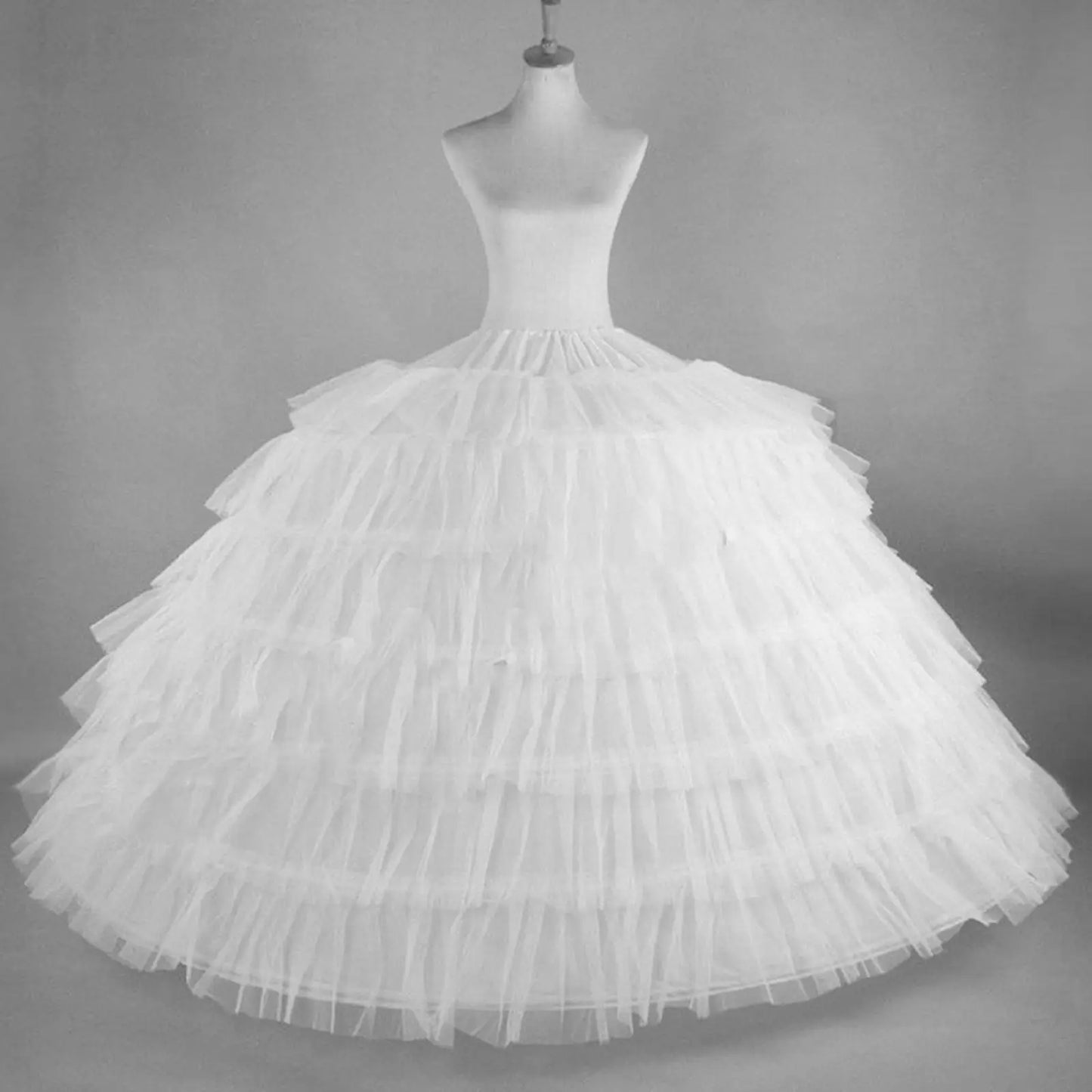 White hoop skirt petticoat underskirt slip for ball gowns, featuring multiple layers for volume and elegance.