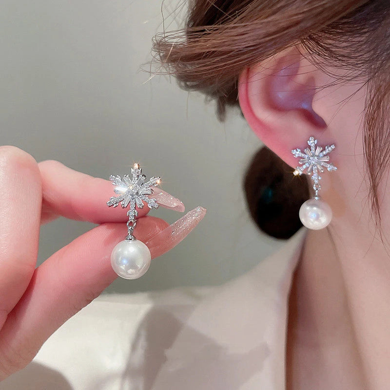 Crystal Snowflake Earrings with Imitation Pearl Wedding Jewelry, Add some winter magic to your look with these stunning snowflake dangle earrings. 