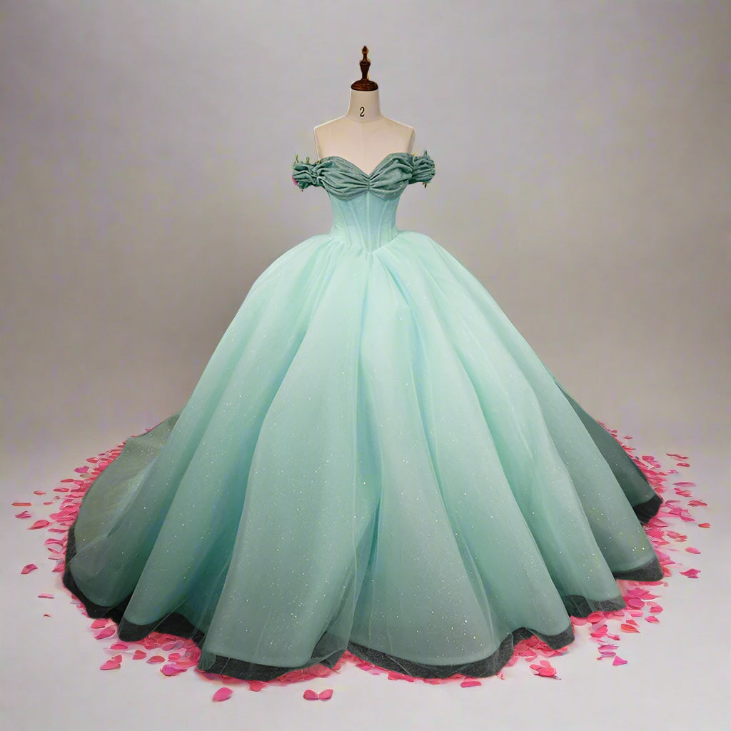 Quinceanera dress in mint green, short sleeves, lace-up back, and voluminous skirt, perfect for a special celebration.