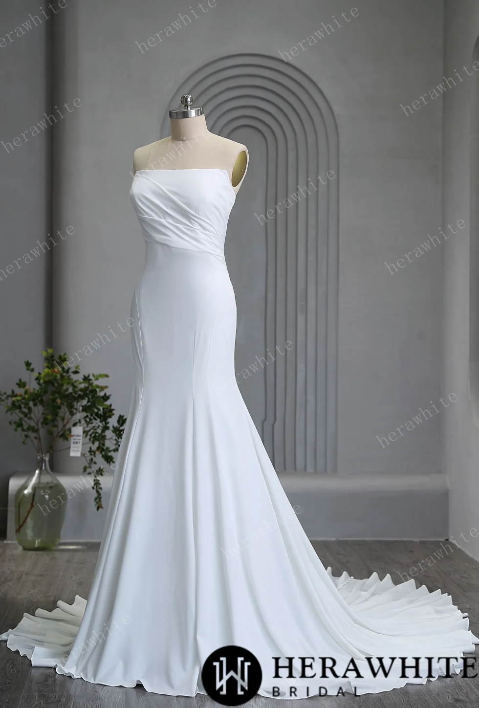 Crepe Trumpet Wedding Dress With Train Sleeveless Bridal Gown, indulge in the strapless design and reveal your stunning shoulders, while the pleated details add a hint of refinement
