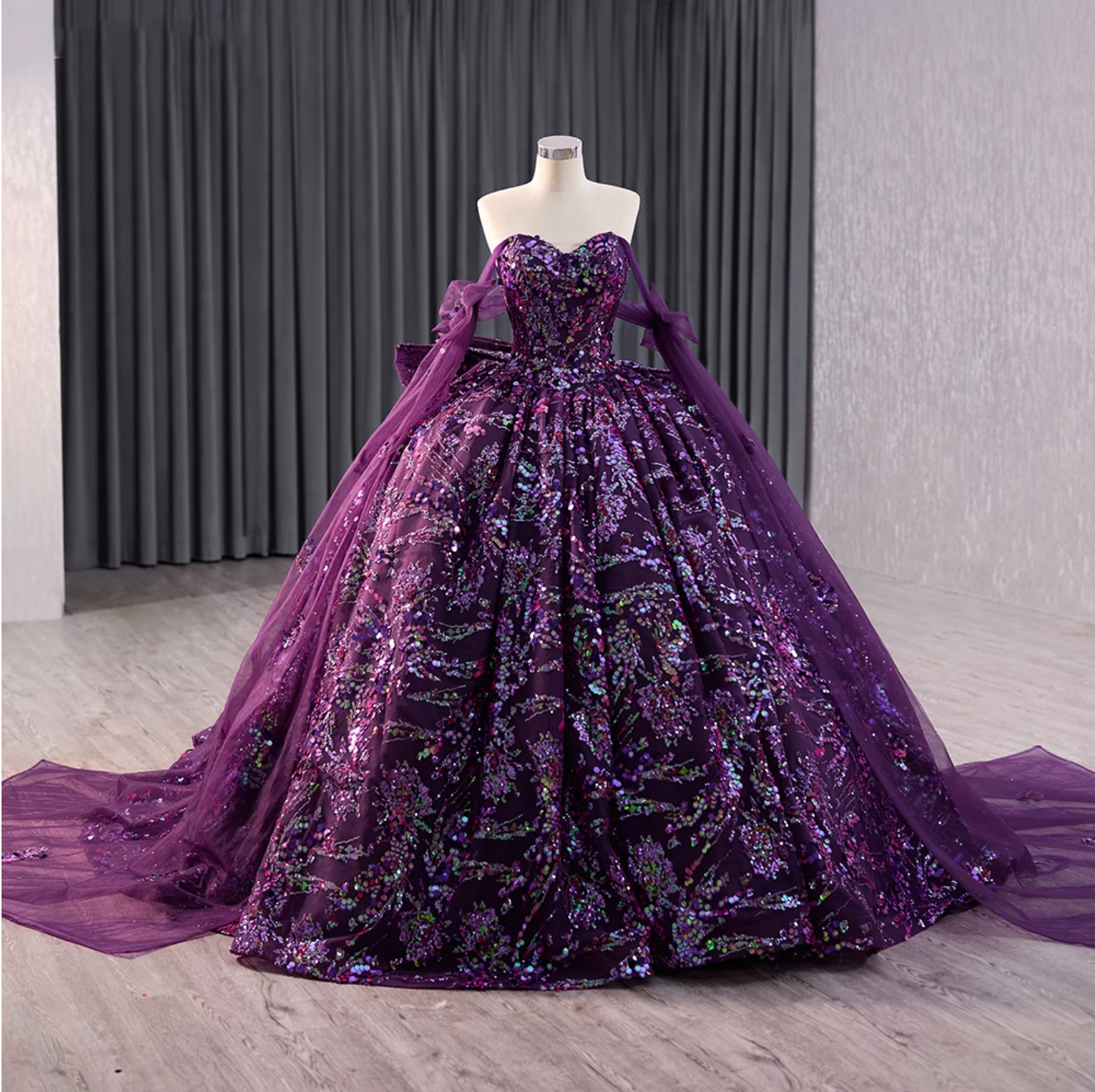 Sweetheart floral deep purple ball gown quinceañera dress with sequined designs and satin ribbon lace up back.