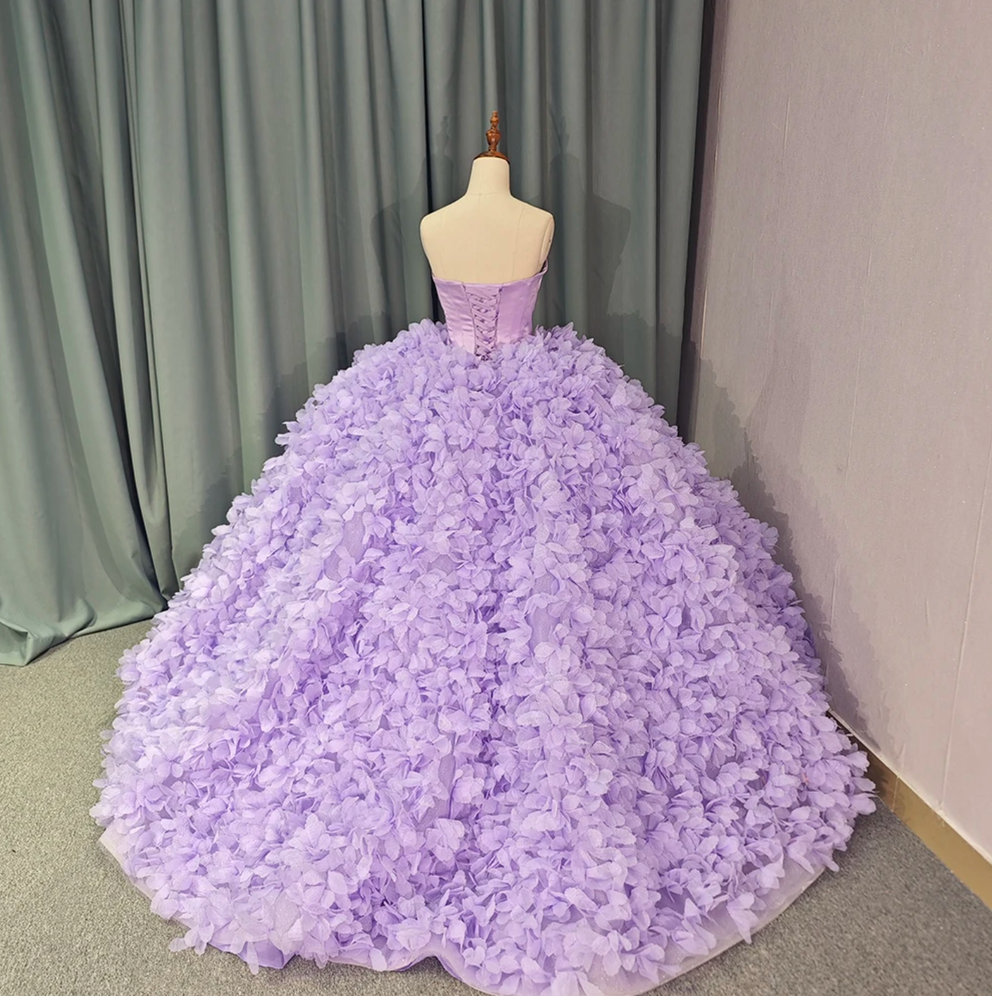 Purple ball gown strapless dress with 3D flower design and court train, perfect for Quinceañera celebrations.