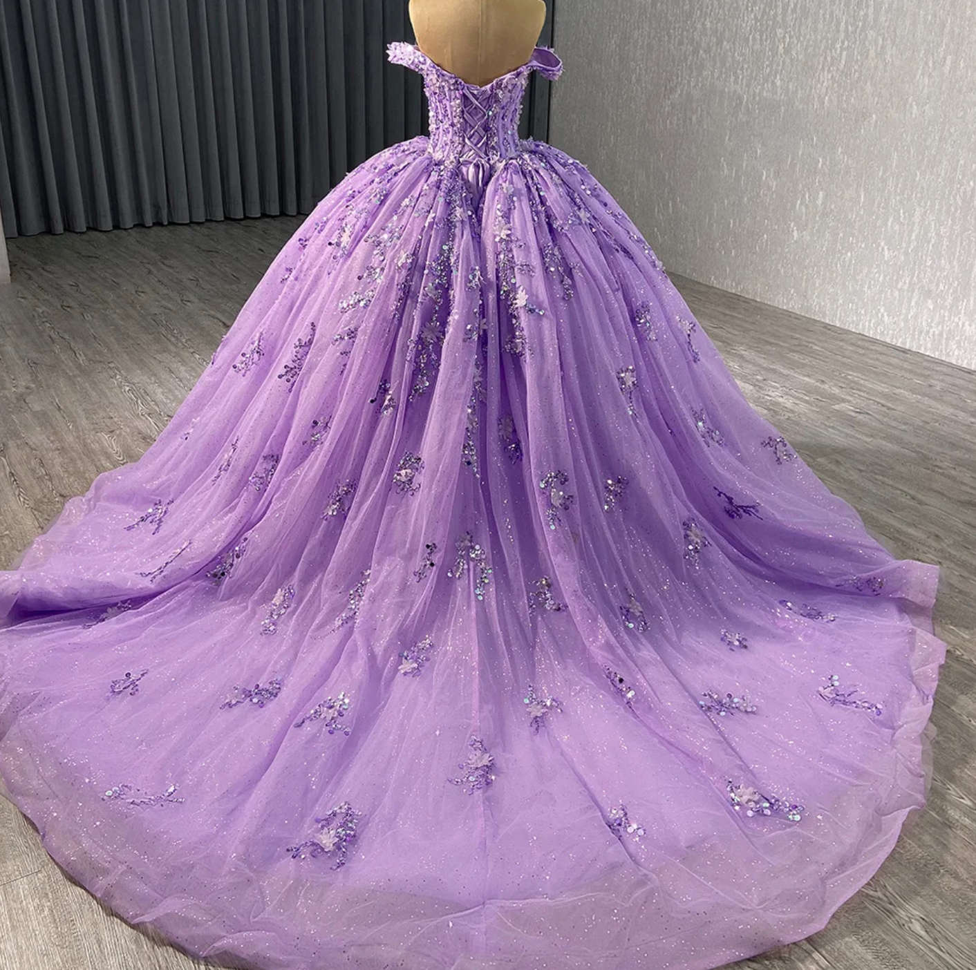 Elegant Sweetheart Purple Quinceañera Dress with glitter tulle and sequined details, featuring a stunning ball gown silhouette.