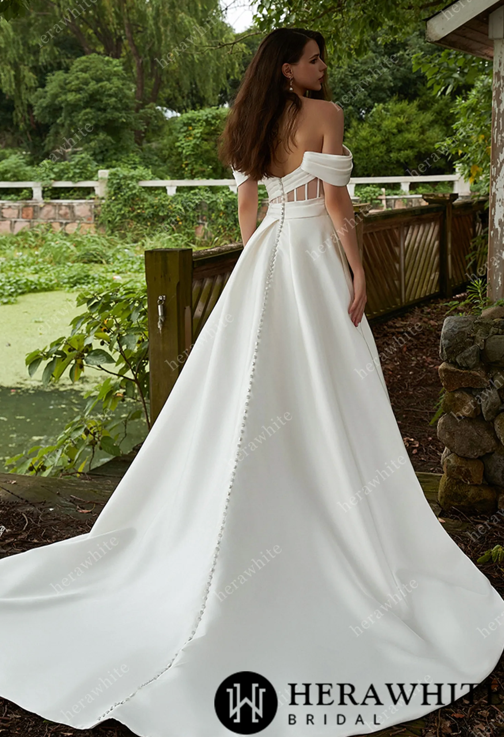 Elegant off-shoulder Mikado wedding dress showcasing a sleek A-line silhouette and dramatic back design.