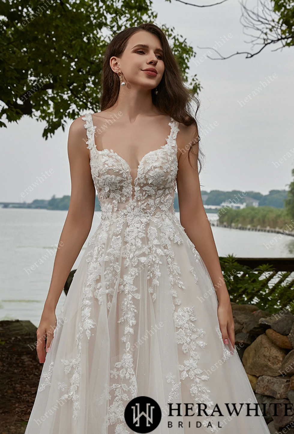 Elegant Tulle V-Neck Straps Wedding Dress with floral lace appliques and flowing A-line silhouette.