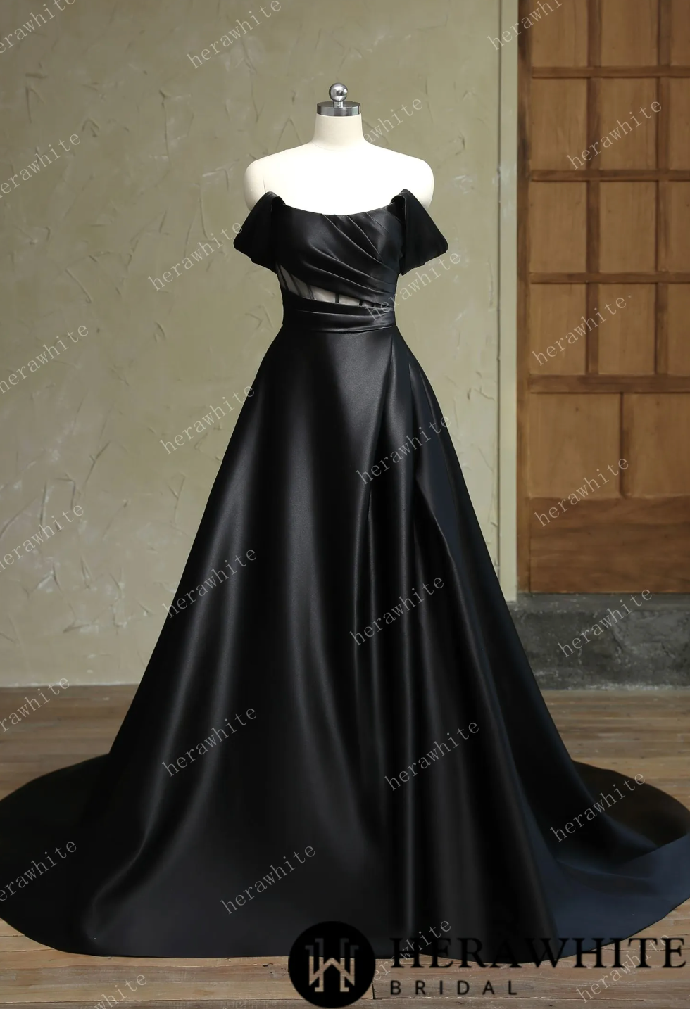 Off shoulder black Mikado wedding dress with slit and strapless bandeau neckline for modern brides.