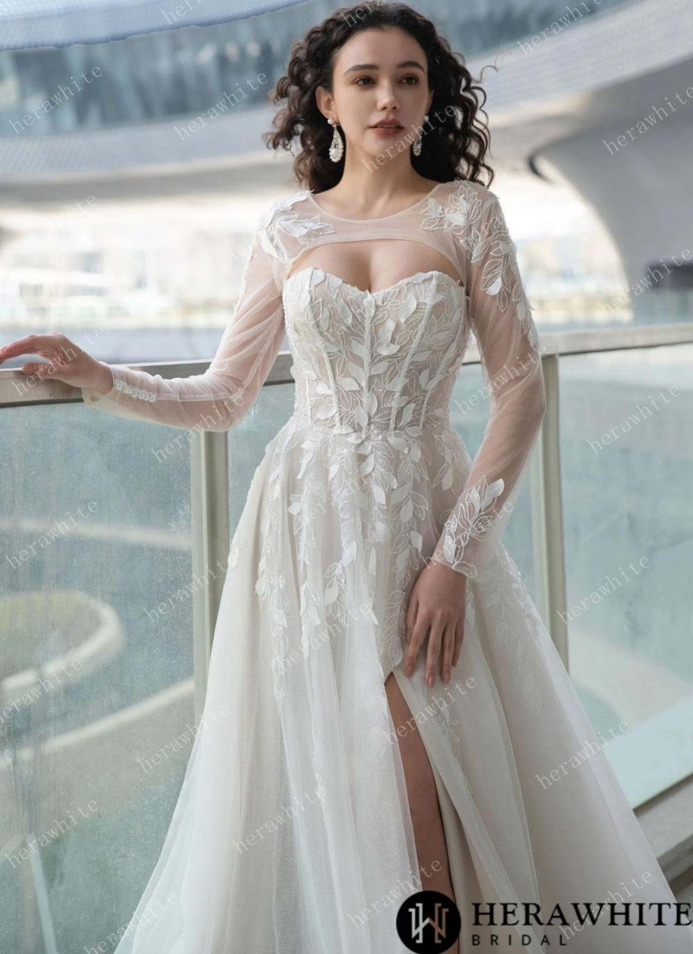Sweetheart lace wedding dress with high slit, featuring long sleeves and elegant floral appliqués.