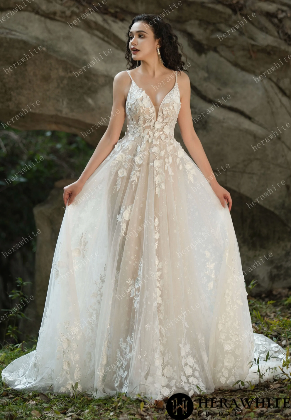 Enchanting V-neck lace wedding dress with spaghetti straps and floral embroidery, creating a romantic bridal look.