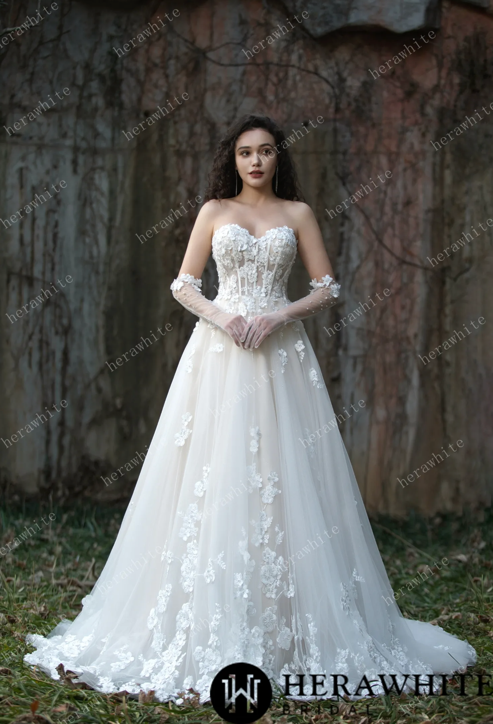 Strapless wedding ball dress with 3D embroidery flowers, tulle layers, creating a romantic bridal look.