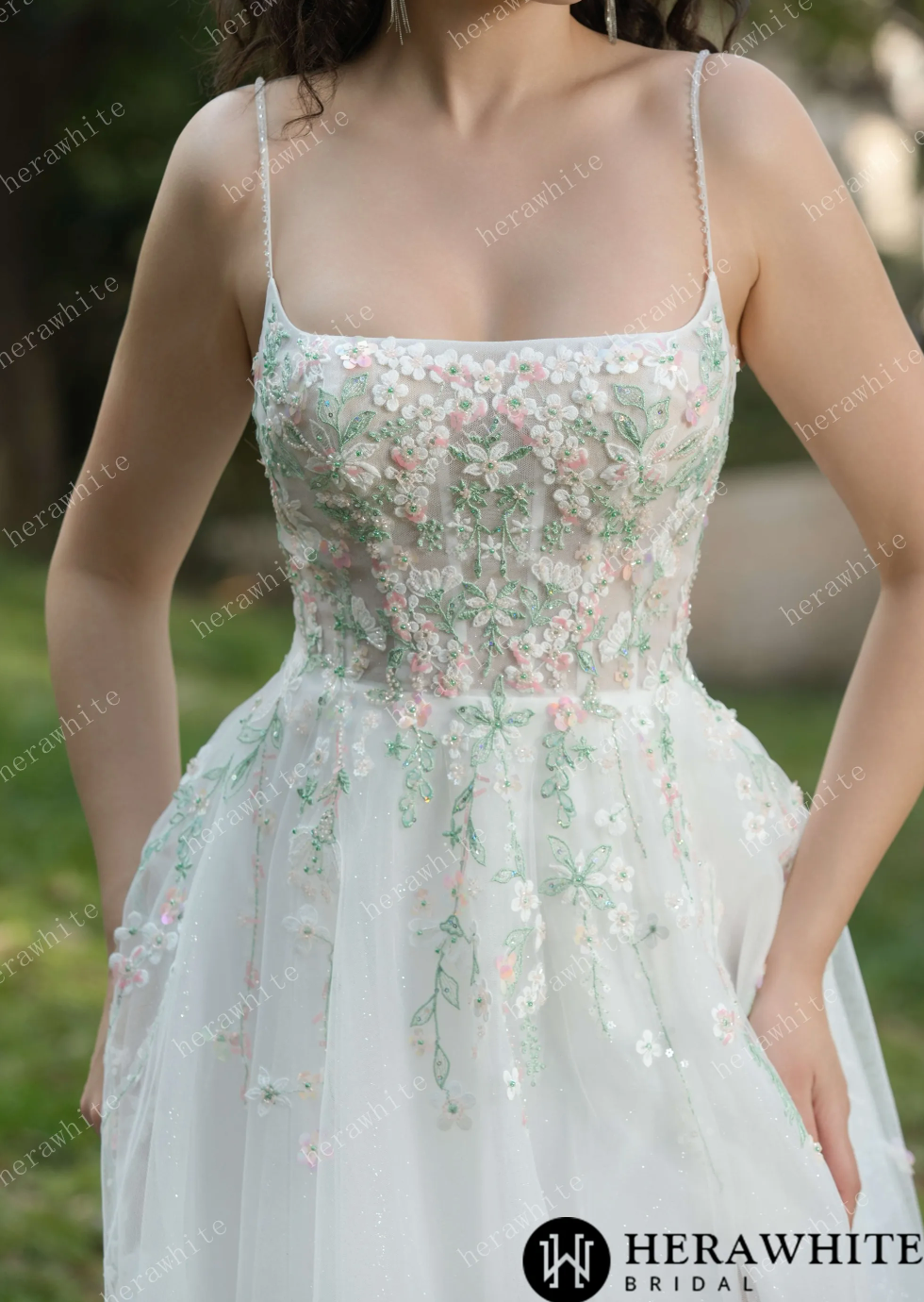 Floral wedding dress with spaghetti straps and square neckline, featuring vibrant embroidery and lightweight tulle skirt.