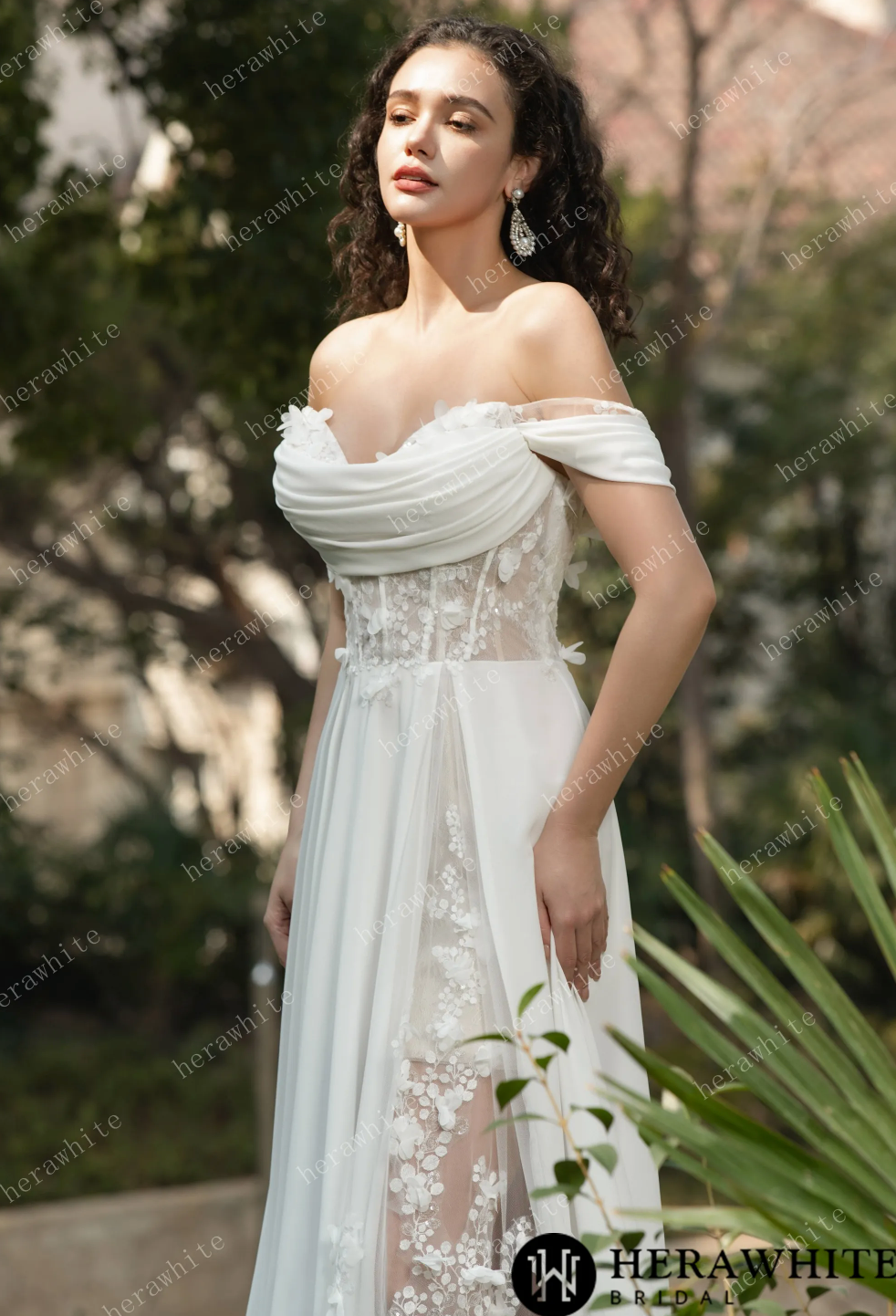 Off the shoulder chiffon wedding dress featuring elegant lace accents and a daring sheer leg design.