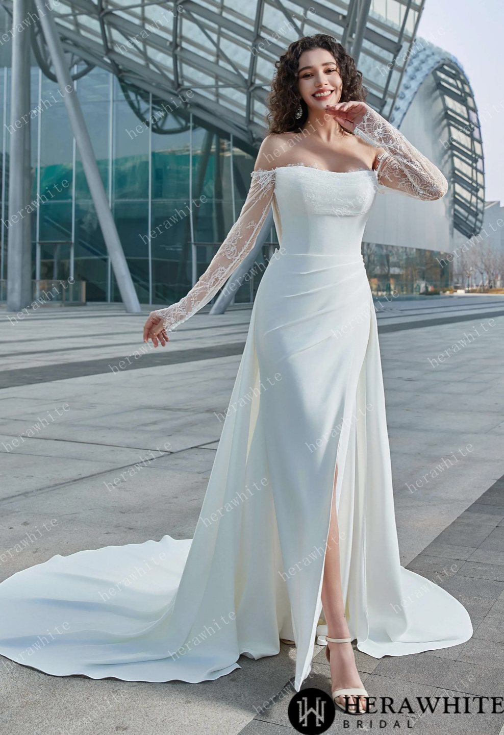 Elegant off-the-shoulder bridal dress with lace sleeves and thigh-high slit, perfect for modern brides.