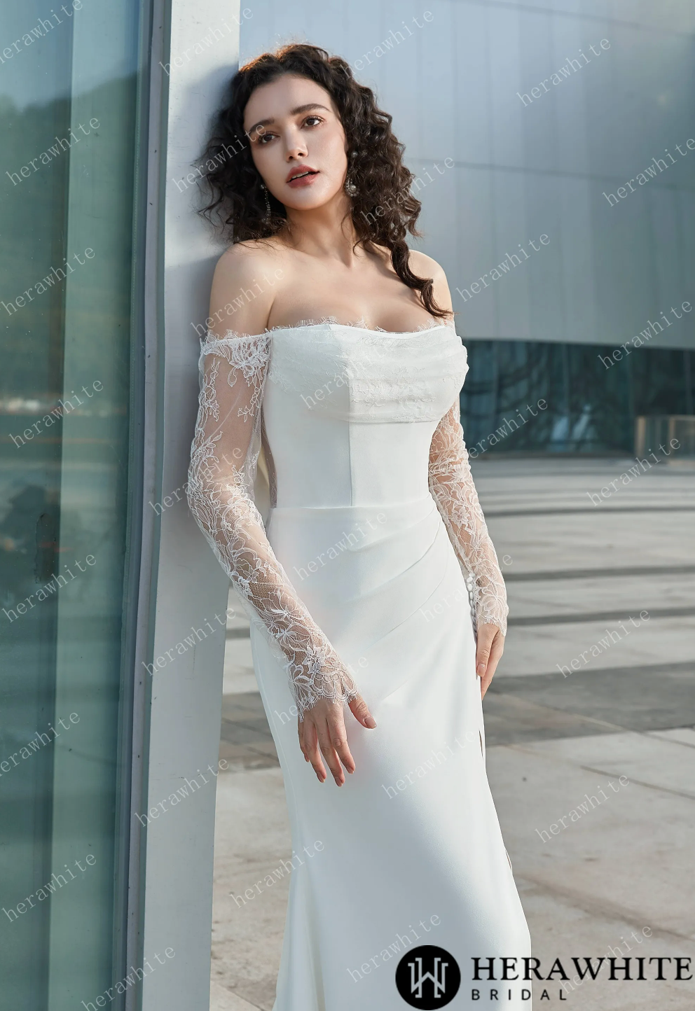 Elegant off the shoulder bridal dress with lace sleeves and a sleek fit, featuring a thigh-high slit and a detachable train.