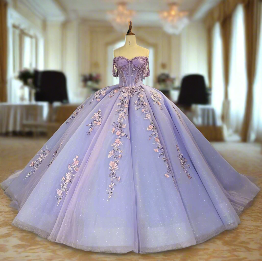 Elegant purple lilac floral quinceanera dress with a sweetheart neckline and voluminous skirt, adorned with delicate flowers.