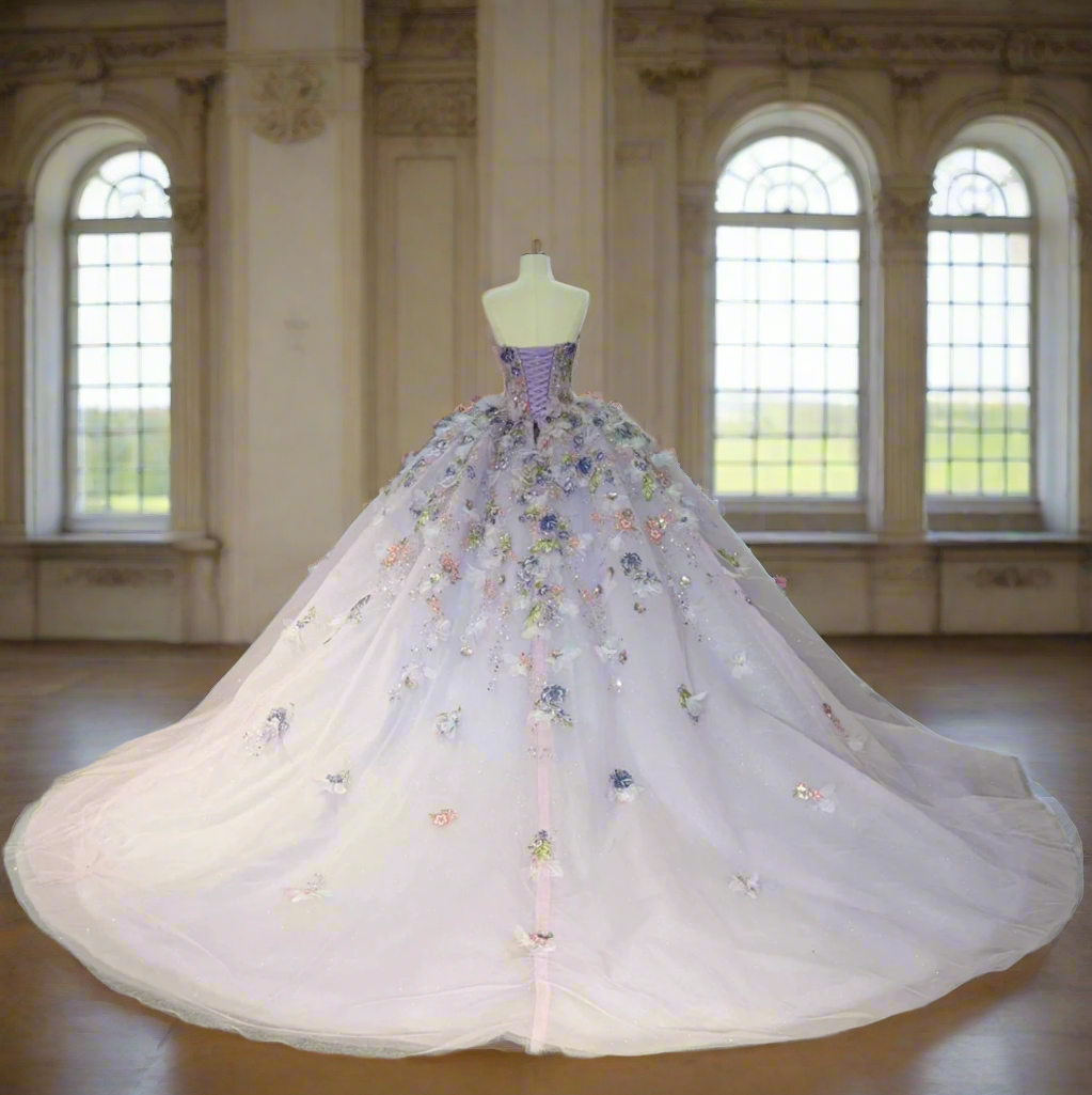 Purple quinceanera dress with floral beadwork, corset bodice, and full layered skirt, perfect for a celebration.