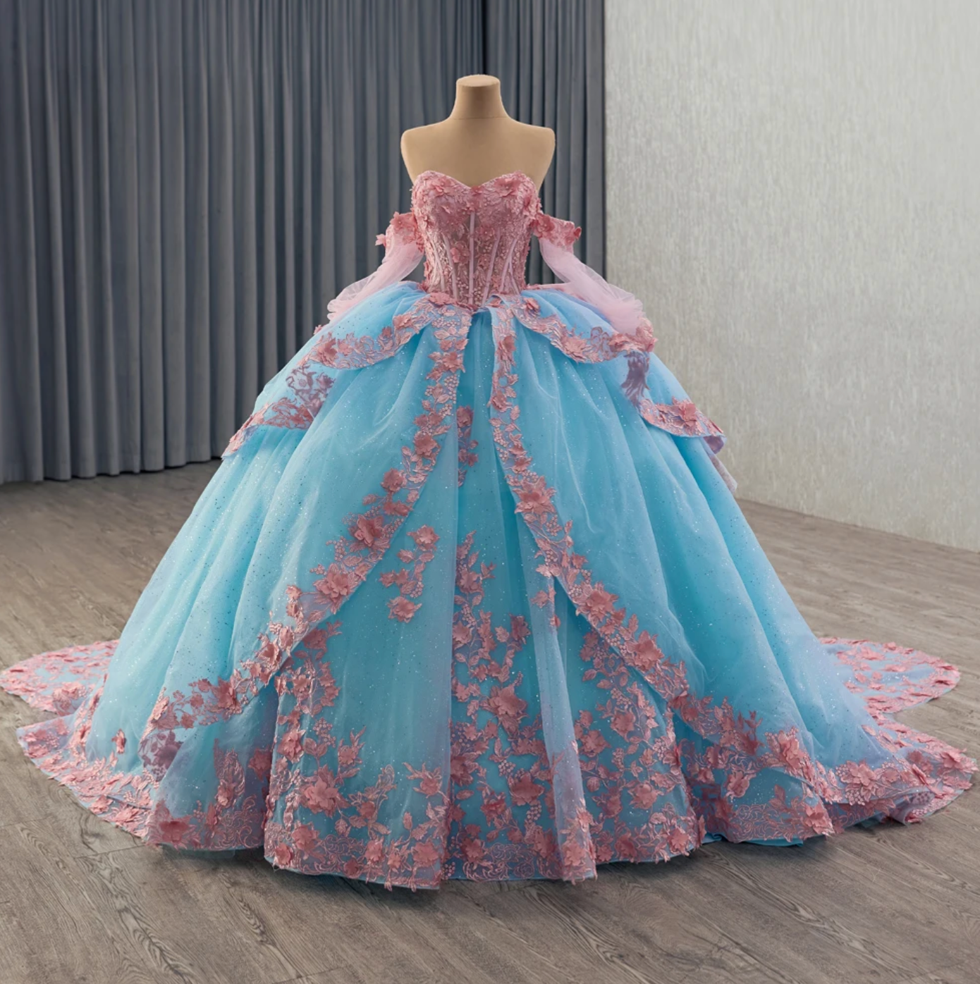 Quinceanera Dress Blue Pink Organza Lace Up Back Ball Gown, combines fantasy and elegance with a sweetheart corset bodice adorned by hand-sewn floral beading.