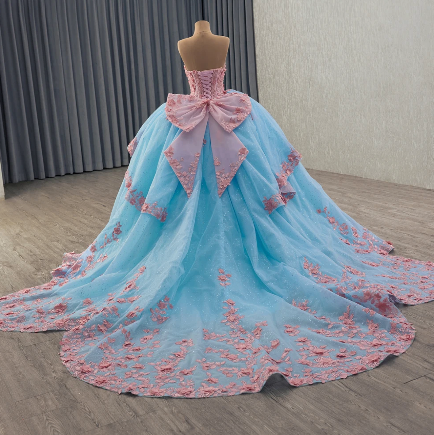 Quinceanera Dress Blue Pink Organza Lace Up Back Ball Gown, combines fantasy and elegance with a sweetheart corset bodice adorned by hand-sewn floral beading.