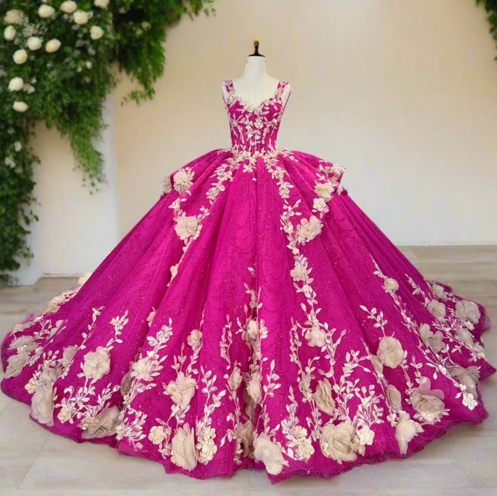 Pink gown with floral embroidery on a mannequin