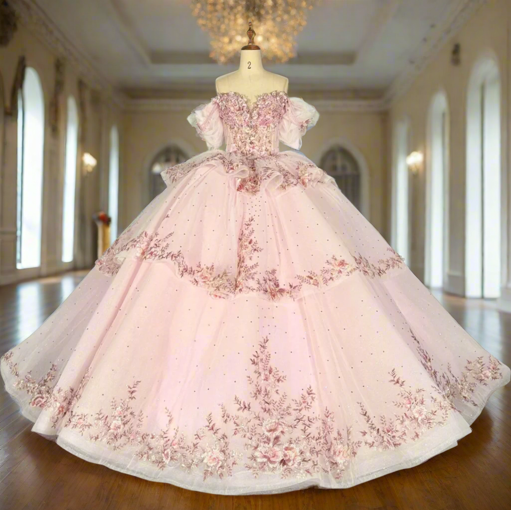 pink quinceanera ball gown in a reception hall
