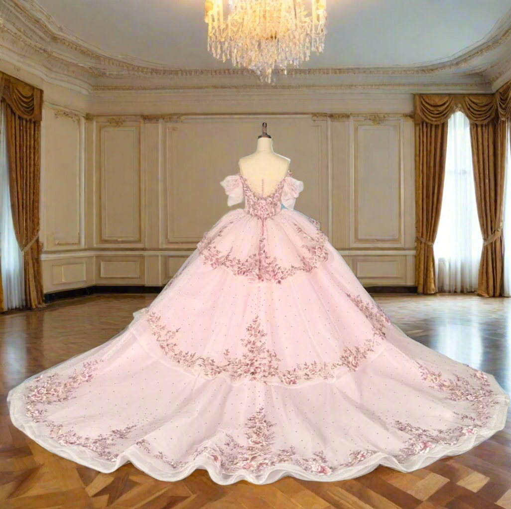 pink quinceanera ball gown in a reception hall