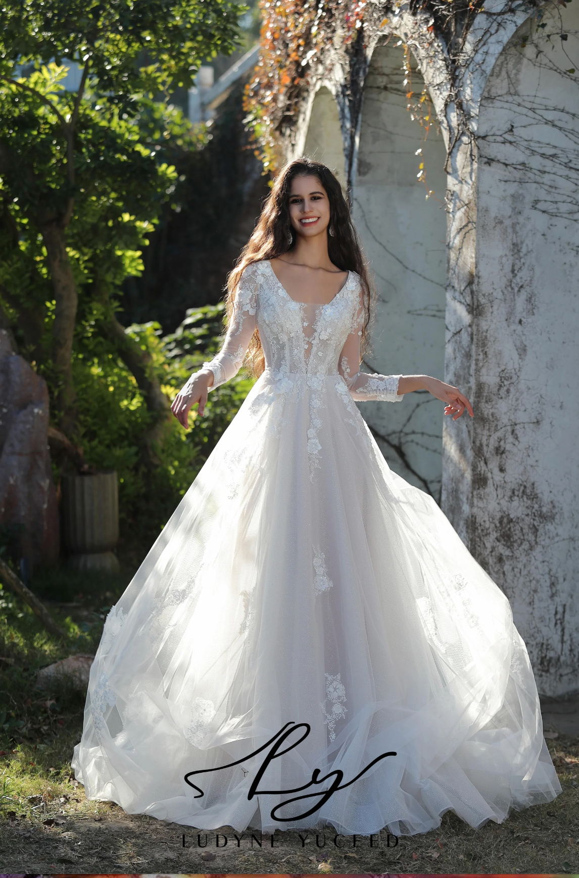 Wedding Dress Long-Sleeved Tulle Lace A-Line Bridal Gown, This gown epitomizes ethereal elegance with its long lace sleeves and bodice adorned with intricate 3D floral details