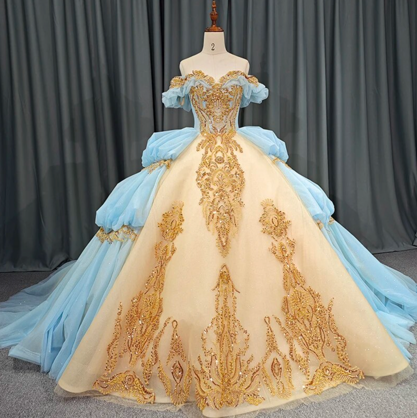 Quinceanera Dress Blue Gold Organza Ball Gown With Train, This unique Quinceanera dress is crafted with luxurious details; a soft, ethereal baby blue hue i