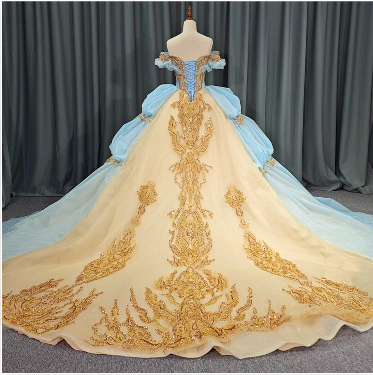 Quinceanera Dress Blue Gold Organza Ball Gown With Train, This unique Quinceanera dress is crafted with luxurious details; a soft, ethereal baby blue hue i