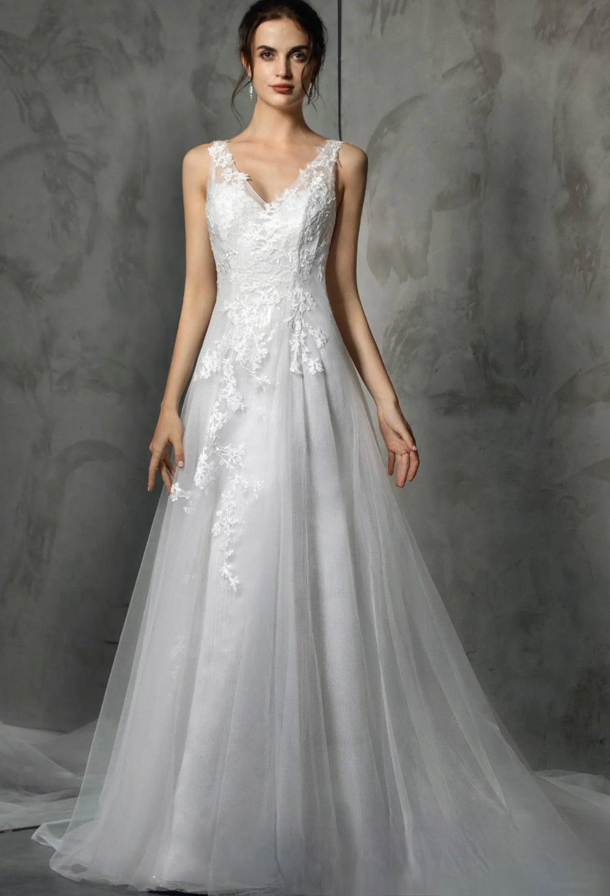 Sleeveless Wedding Dress Lace Satin Sequines A Line Bridal Gown With Train, this sleeveless bridal gown features V-neckline and lace appliqués 