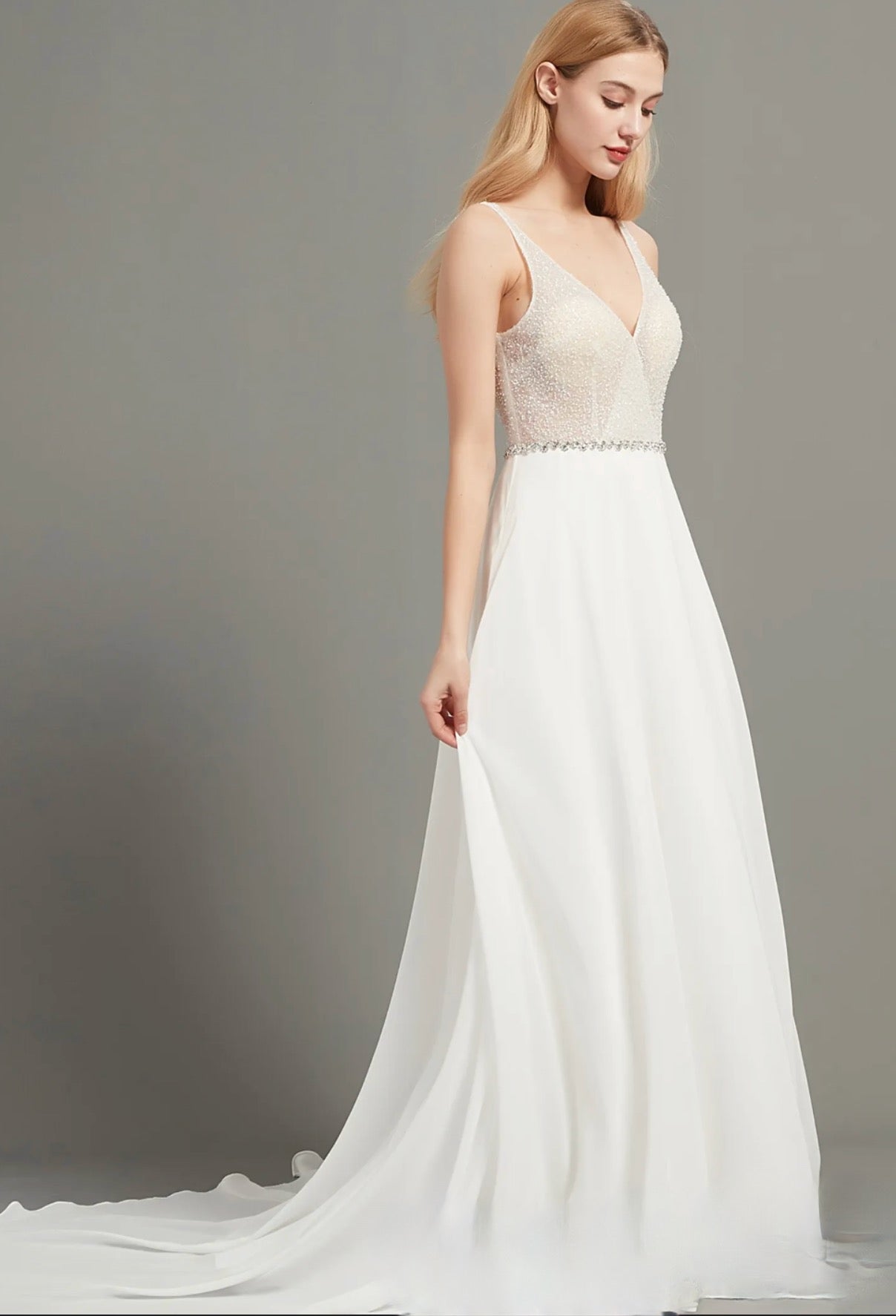 A Line Chiffon Wedding Dress Crystal Beaded Tulle Bridal Gown, an amazing  v-neckline beaded bodice with an a-line silhouette. 