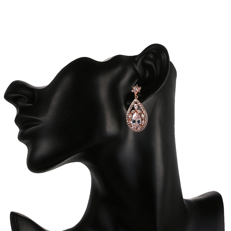 Large water drop Crystal Party Earrings Evening Event Jewelry Accessory with water drop pattern come in rose gold and platinum both with clear stones.