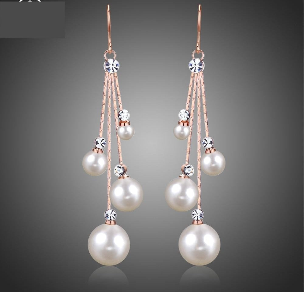 Crystal Simulated Pearl Wedding Earrings Dangle Drop Bridal Accessory, these striking bridal earrings blend lustrous simulated pearls with radiant crystals 