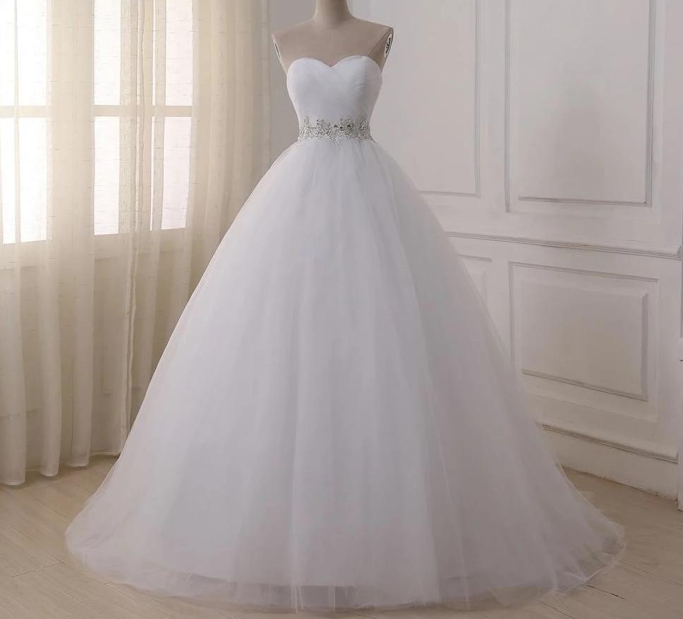 Simple Wedding Dress Draped Tulle Sleeveless A Line Bridal Gown, glide down the aisle in this enchanting sleeveless tulle gown, where romance meets effortless elegance.